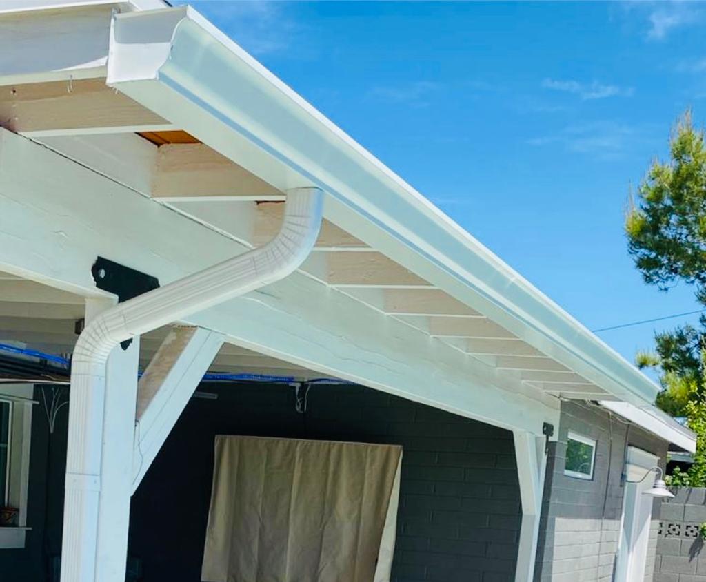White seamless gutter installation